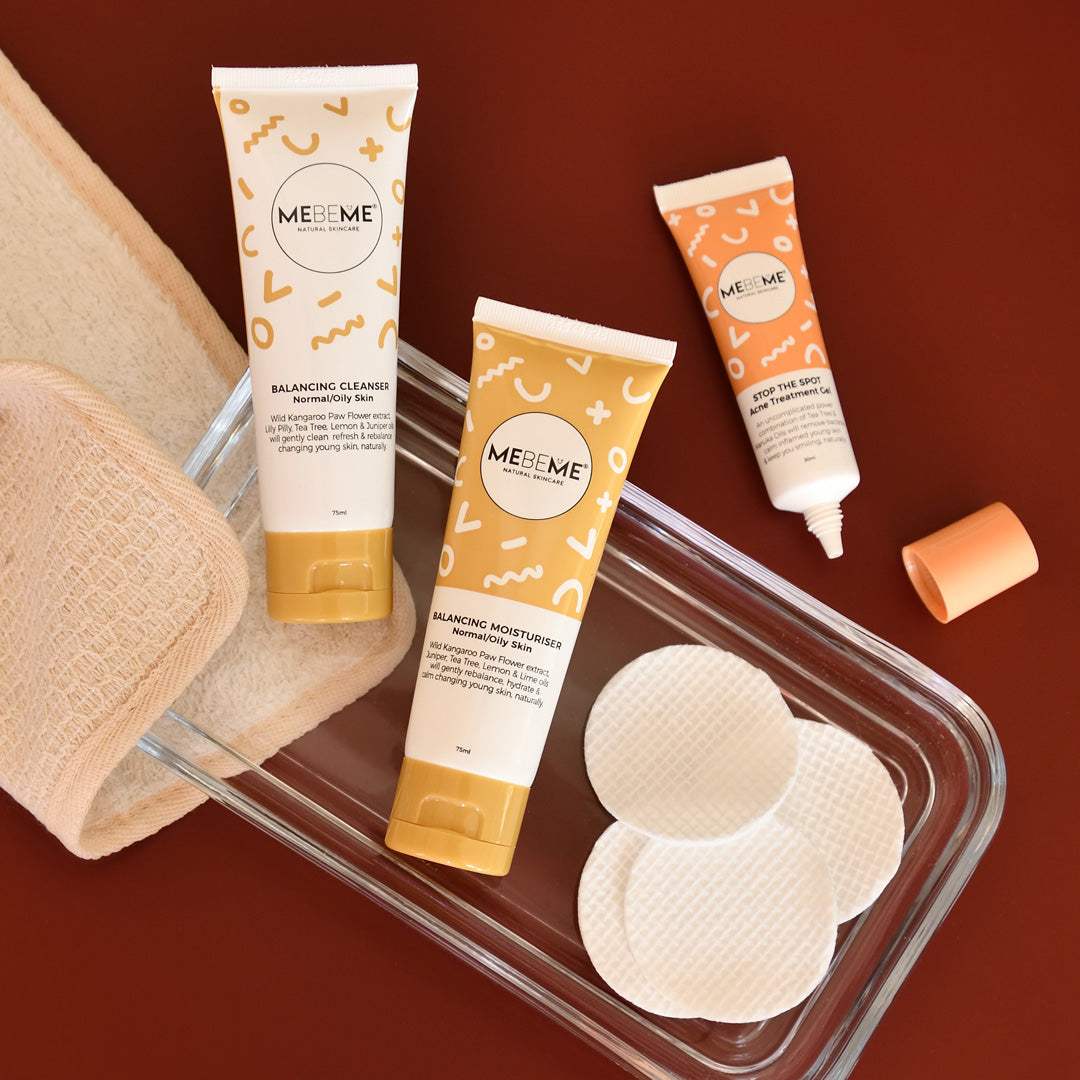 MEBEME skincare products including cleanser, moisturizer, and pads on a brown background
