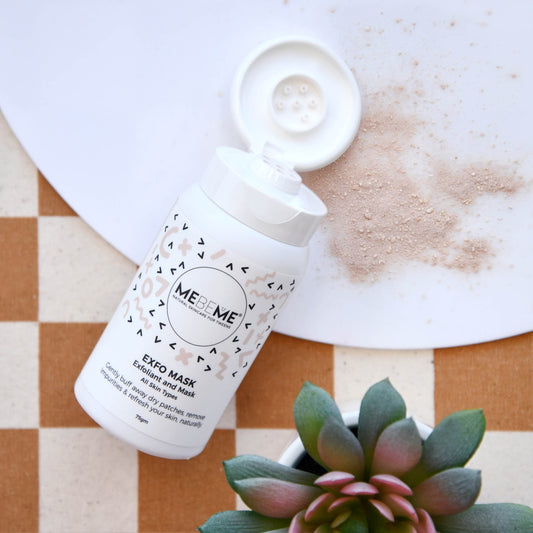 MEBEME EXFO MASK bottle with a small plant on a checkered surface