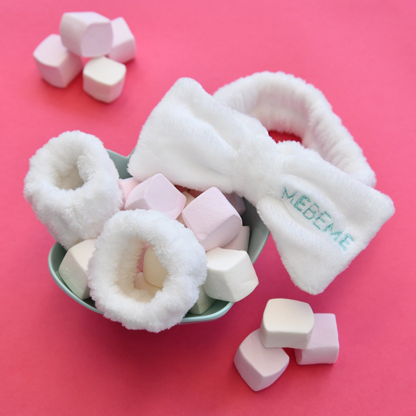 White Fluffy headband and dry cuff set with 'MEBEME' branding on a pink background with marshmallows.