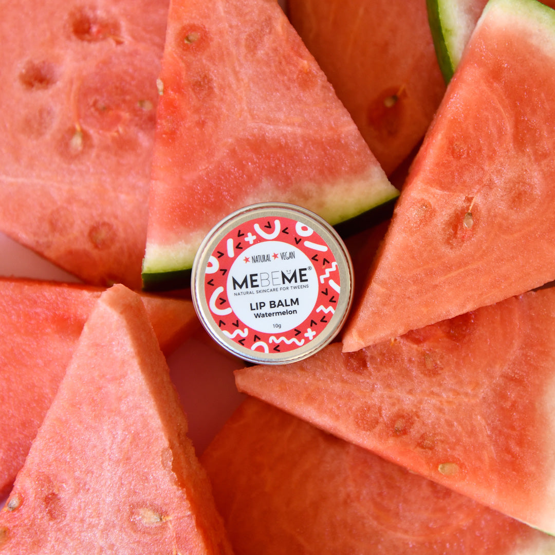 watermelon lip balm sitting on slices of watermelon